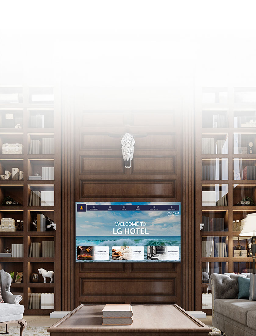 A luxury hotel room features a central TV equipped with LG Pro:Centric, displaying a welcome message to guests.