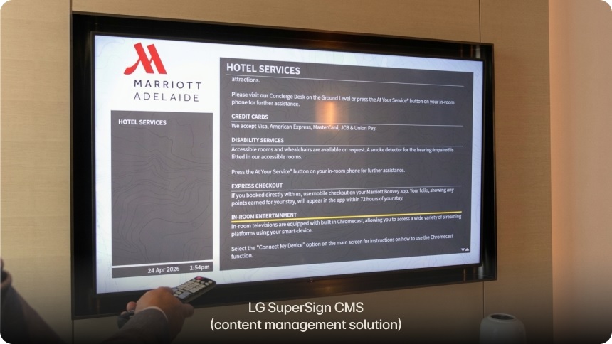LG SuperSign CMS content management solution displayed on an LG Hospitality TV and operated using a remote control.